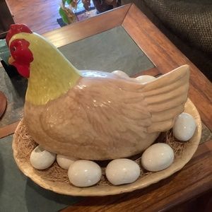 Handcrafted ceramic chicken, eggs and ceramic base.